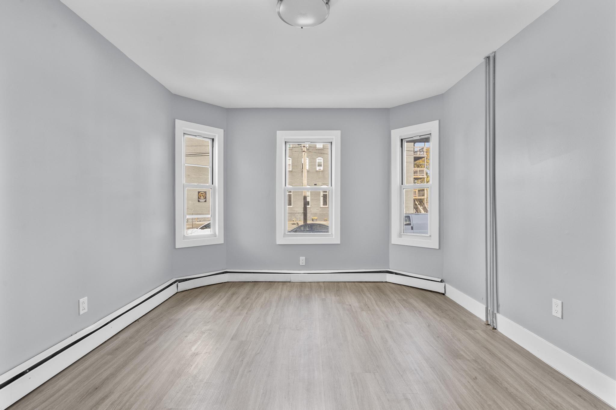 746 Maple Street Bridgeport, CT 06608 - Photo 20 of 38 a view of room with window and hardwood floor