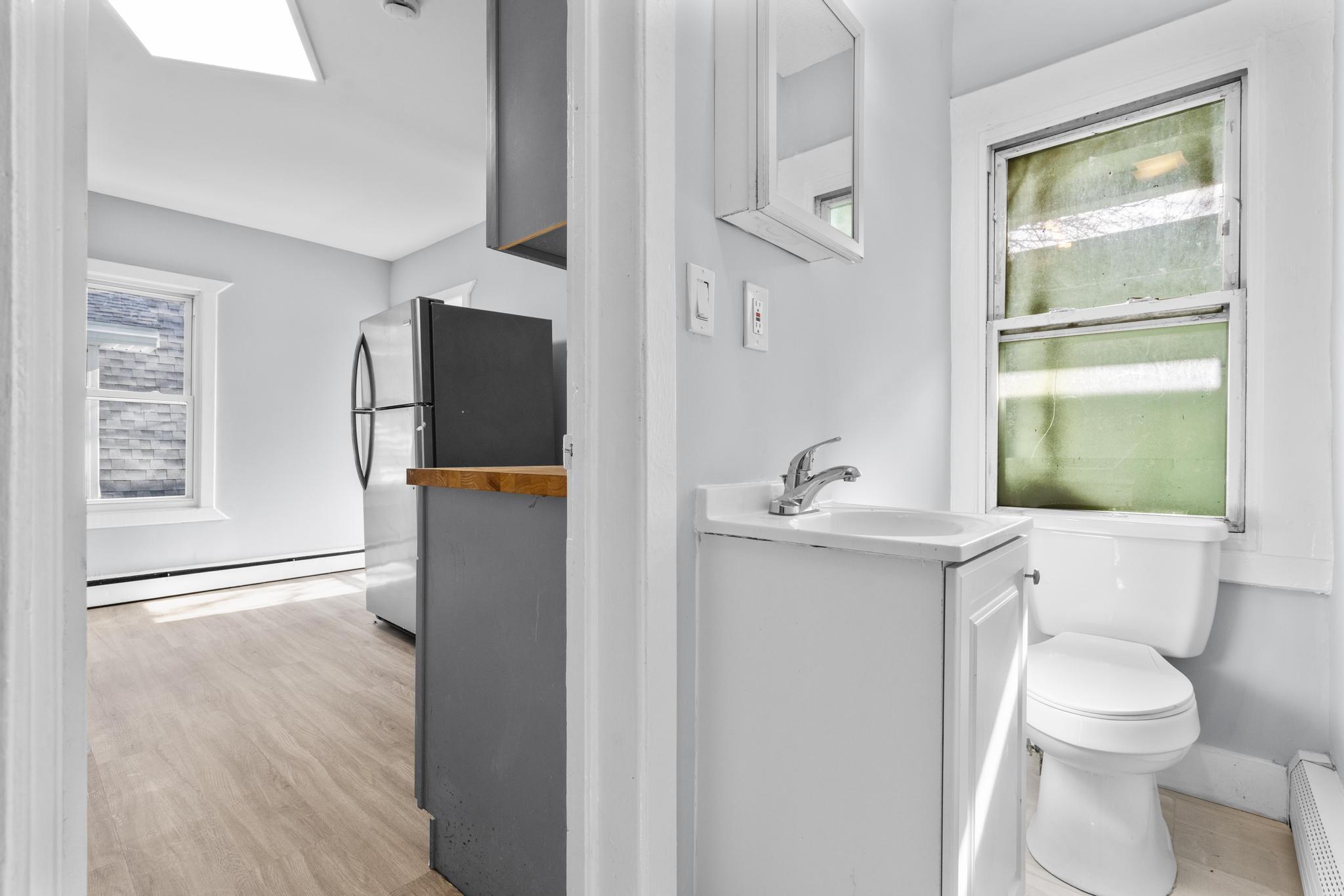 746 Maple Street Bridgeport, CT 06608 - Photo 27 of 38 a bathroom with a sink toilet and shower