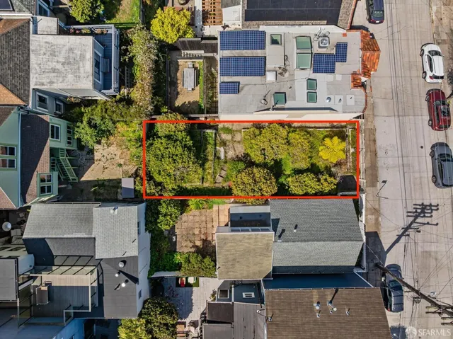 a aerial view of a house with a yard