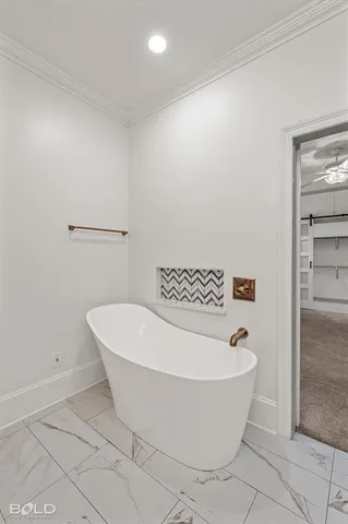 a white bath tub sitting in a bathroom