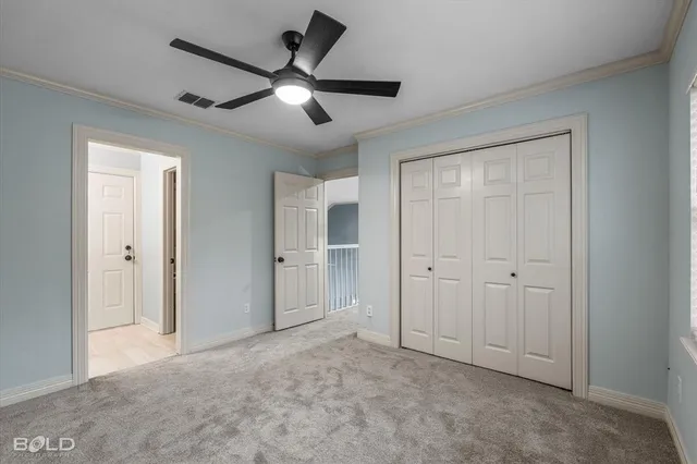 an empty room with closet area