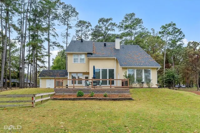 a house view with swimming pool and garden view