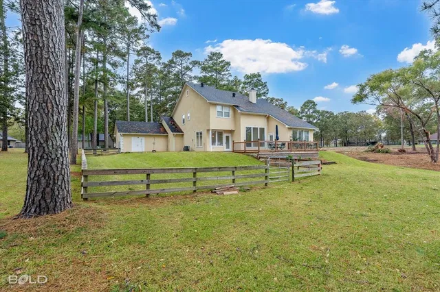a view of a house with a yard porch and sitting area
