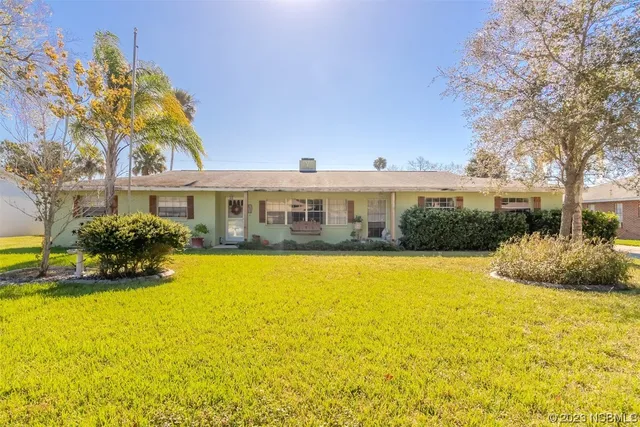 a front view of a house with swimming pool