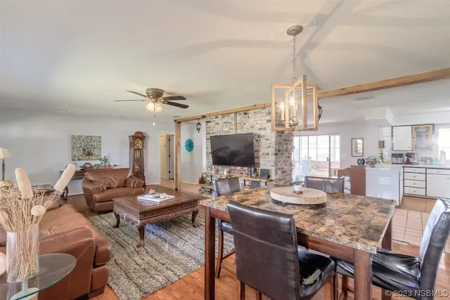 a living room with lots of furniture and a flat screen tv