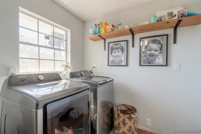 a utility room with dryer and washer
