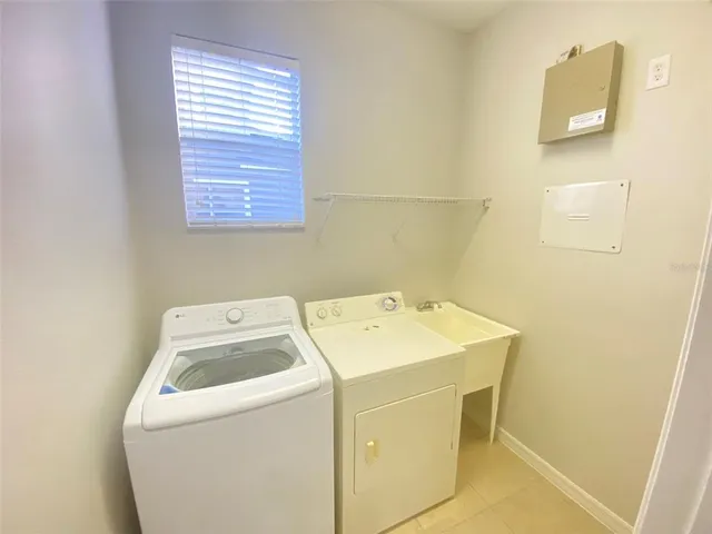 a utility room with dryer and washer