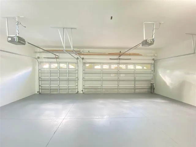 an empty room with a empty space and windows