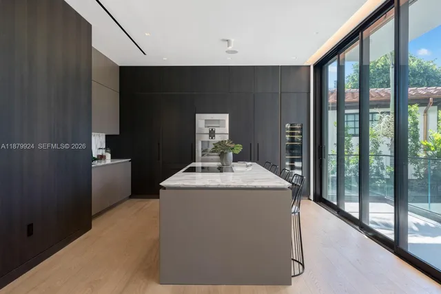 a bathroom with a sink a mirror and a shower