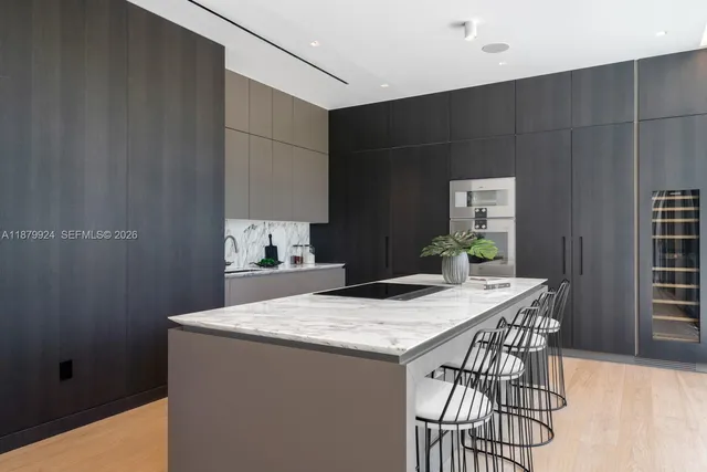 a view of a room with a table and chairs