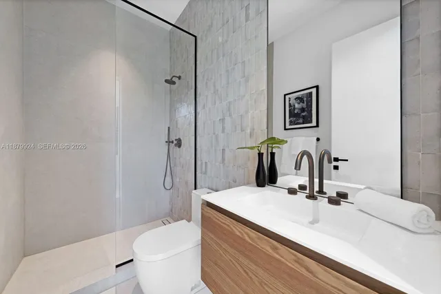 a bedroom with furniture and a large window