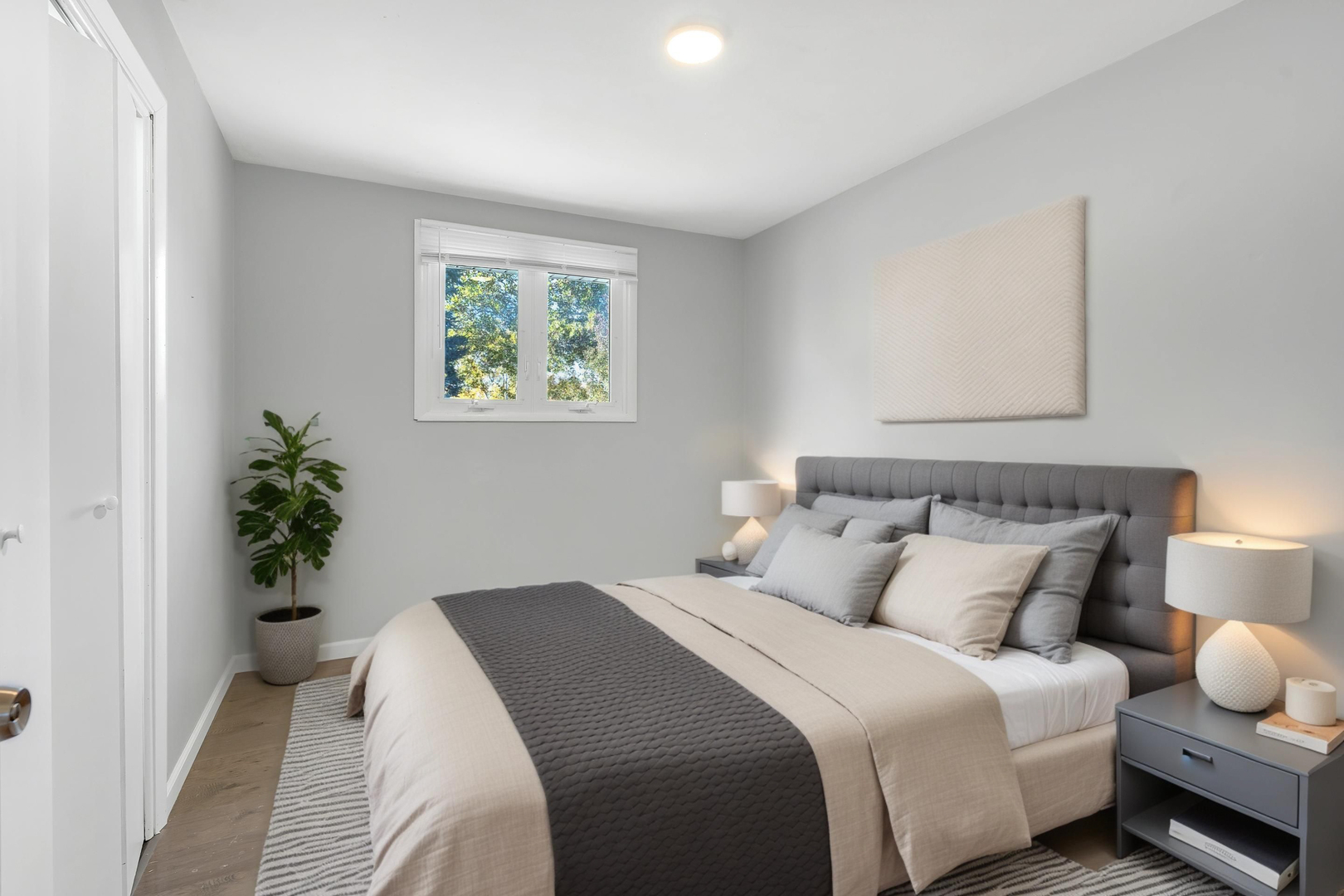 403 Arrowhead Trail Carol Stream, IL 60188 - Photo 11 of 22 a bedroom with bed and a potted plant