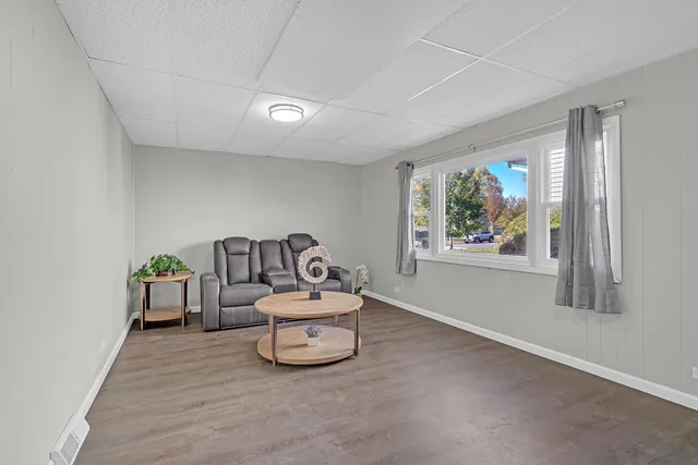 a spacious bedroom with a bed and a window