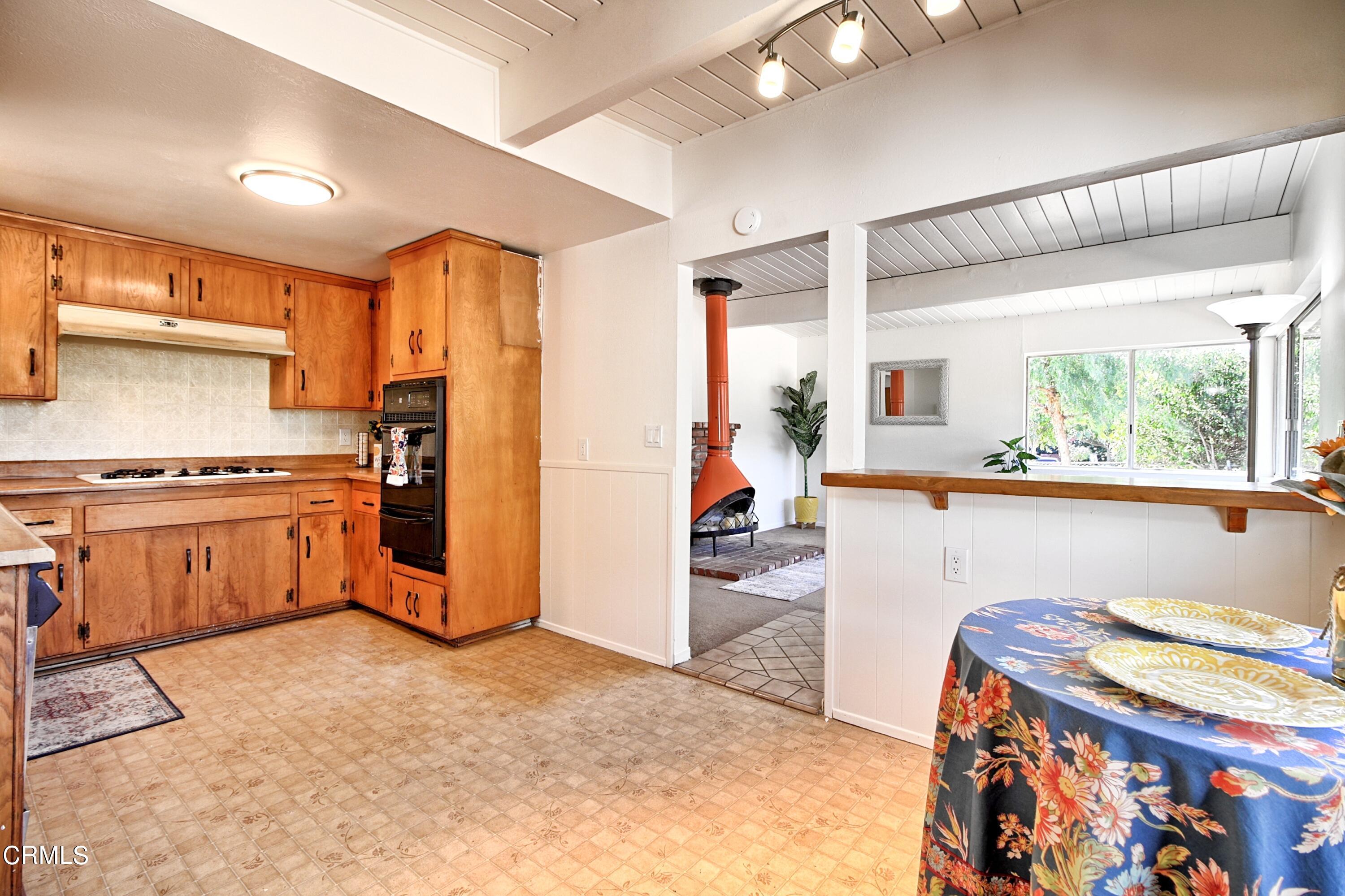 118 Burnham Road Oak View, CA 93022 - Photo 24 of 30 a kitchen with stainless steel appliances granite countertop a stove a sink and a refrigerator