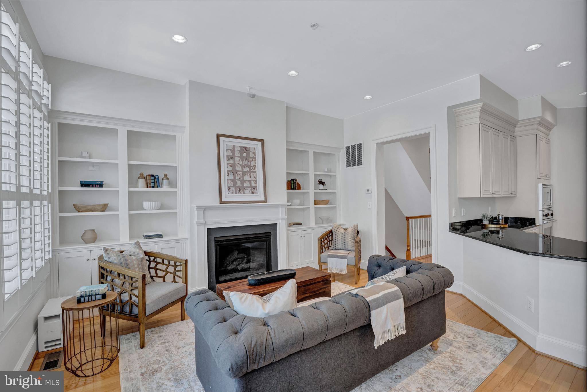 1820 Carpenter Road Alexandria, VA 22314 - Photo 12 of 80 a living room with furniture flat screen tv and a fireplace