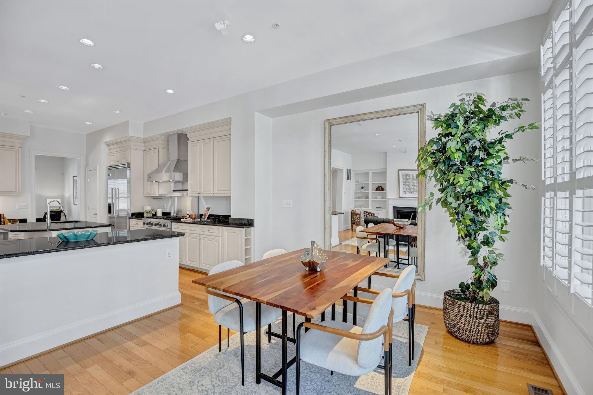 1820 Carpenter Road Alexandria, VA 22314 - Photo 14 of 80 a kitchen with a table and chairs in it