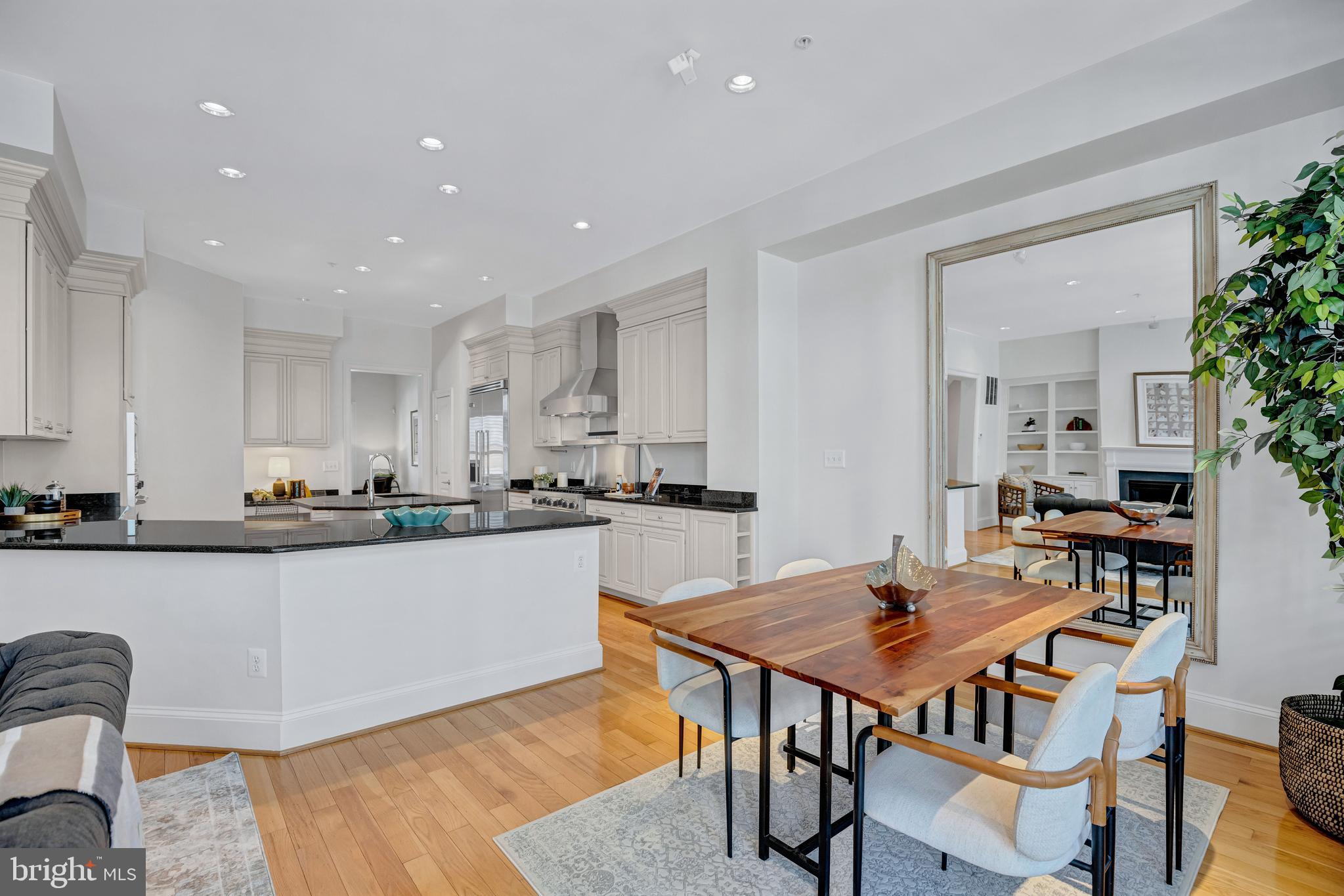 1820 Carpenter Road Alexandria, VA 22314 - Photo 16 of 80 a kitchen with stainless steel appliances granite countertop a table and chairs in it