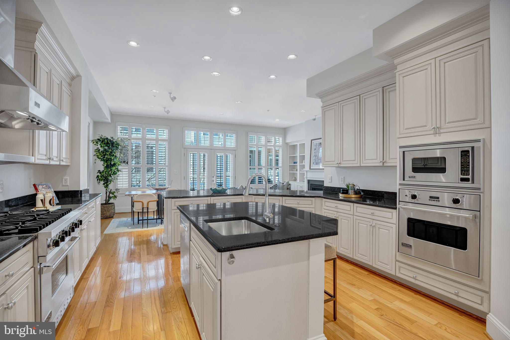 1820 Carpenter Road Alexandria, VA 22314 - Photo 18 of 80 a kitchen with granite countertop a sink a counter space appliances and cabinets