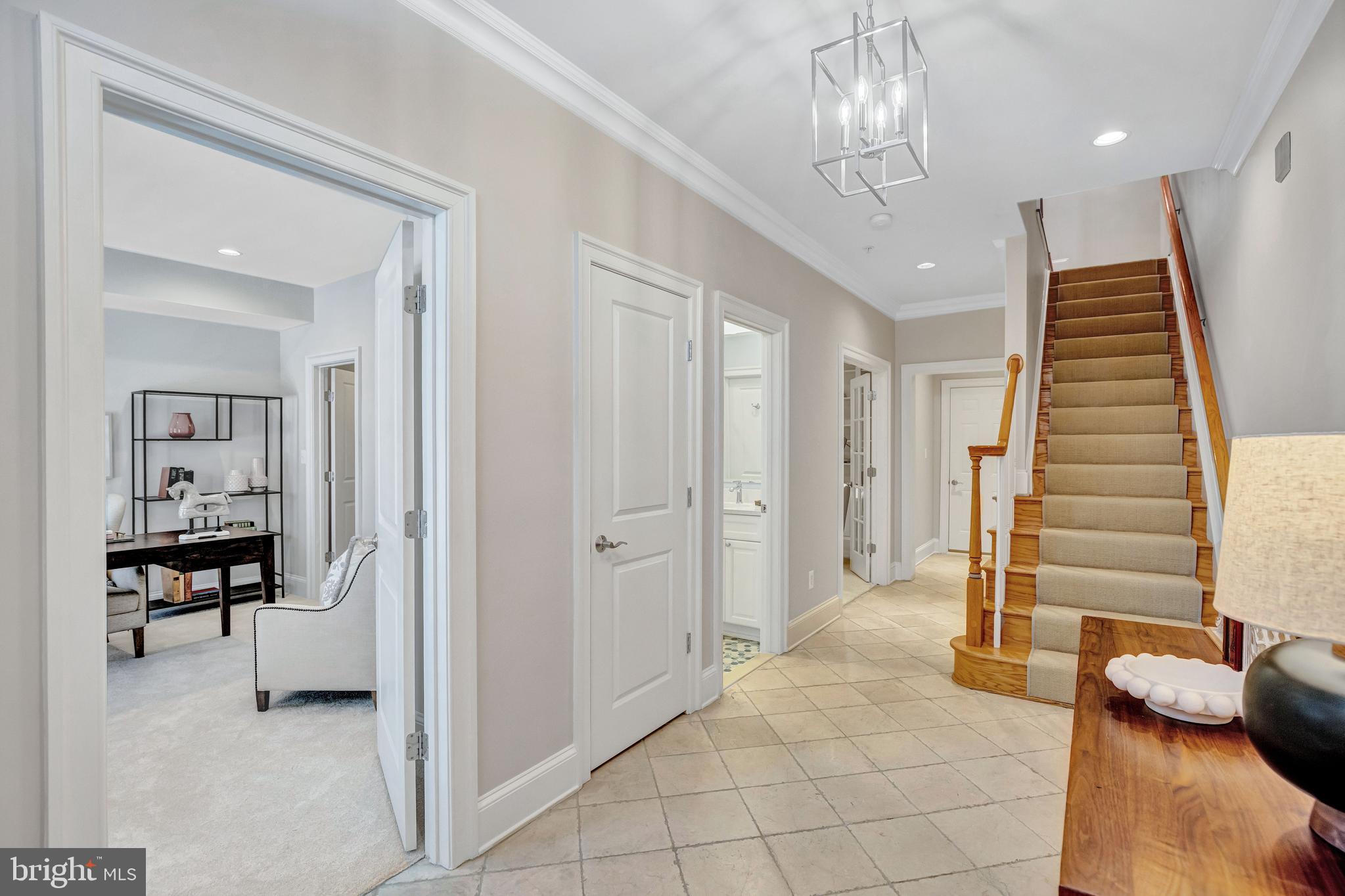 1820 Carpenter Road Alexandria, VA 22314 - Photo 2 of 80 a view of a livingroom with furniture and stairs