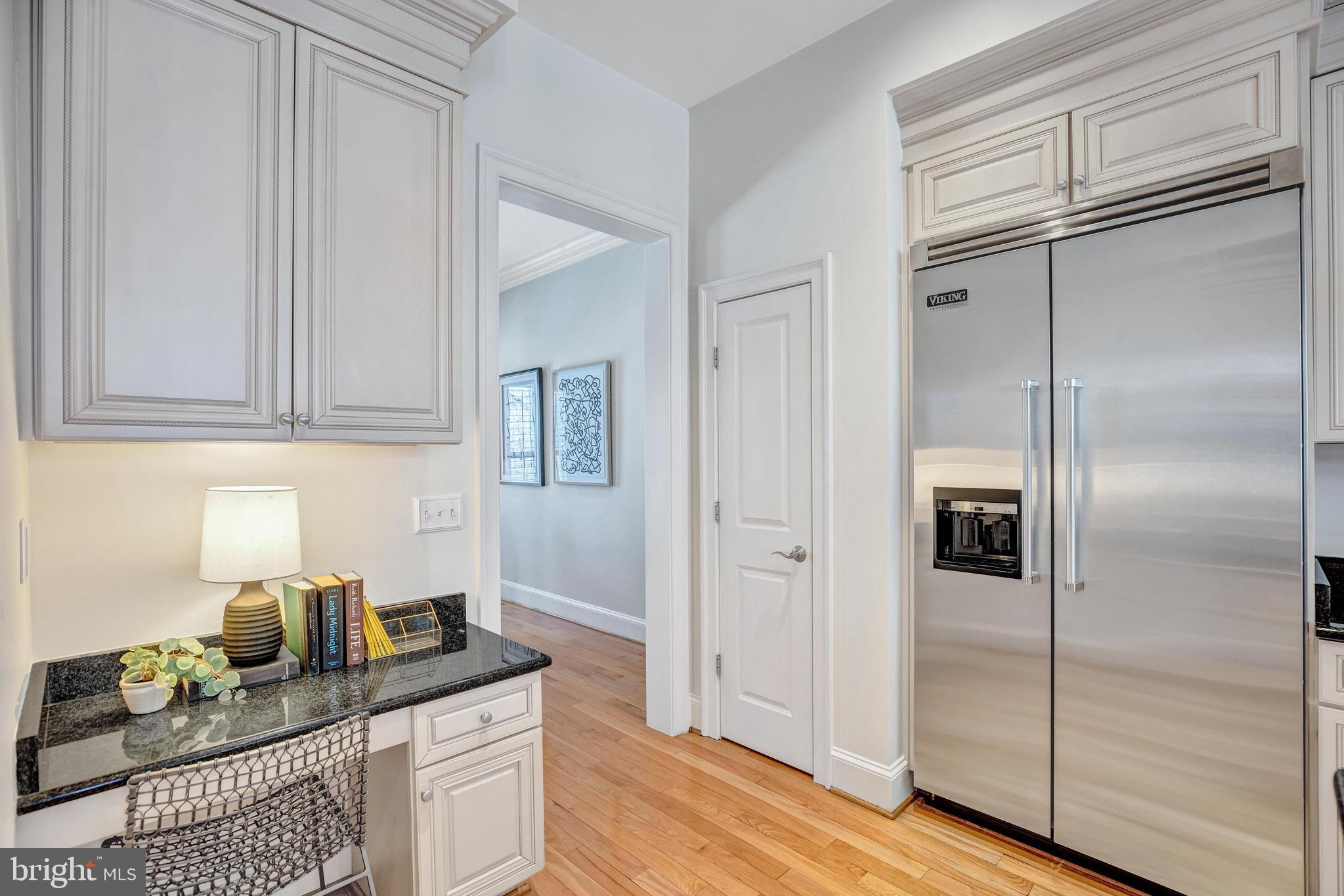 1820 Carpenter Road Alexandria, VA 22314 - Photo 20 of 80 a kitchen with granite countertop stainless steel appliances a refrigerator and cabinets