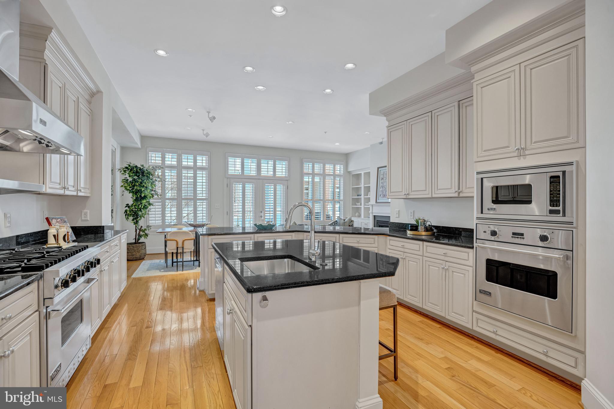 1820 Carpenter Road Alexandria, VA 22314 - Photo 22 of 80 a kitchen with stainless steel appliances granite countertop a stove a sink and a microwave