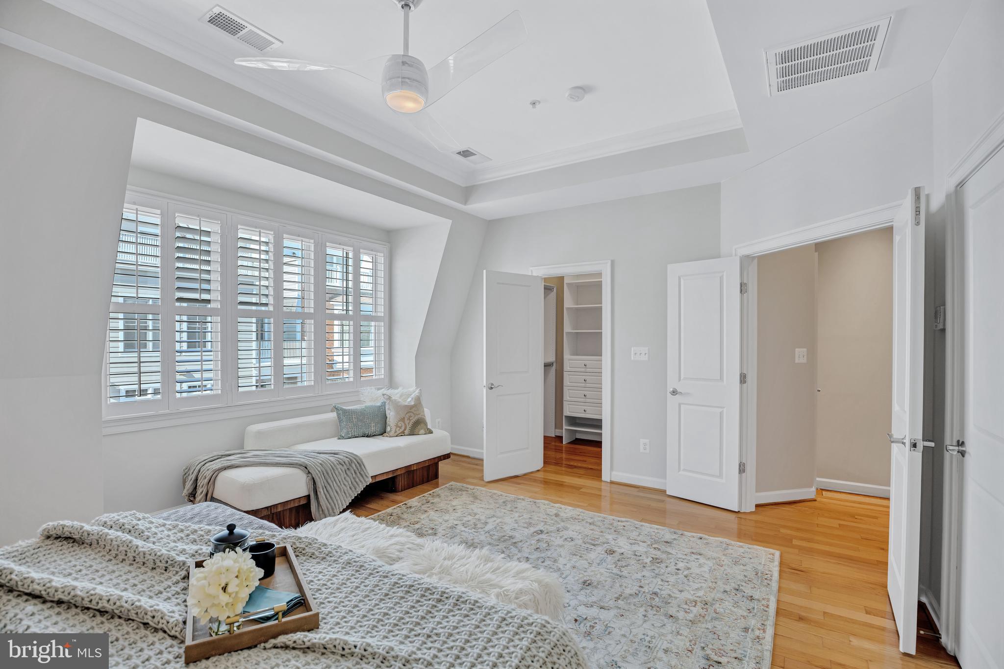 1820 Carpenter Road Alexandria, VA 22314 - Photo 32 of 80 a bedroom with a bed and wooden floor