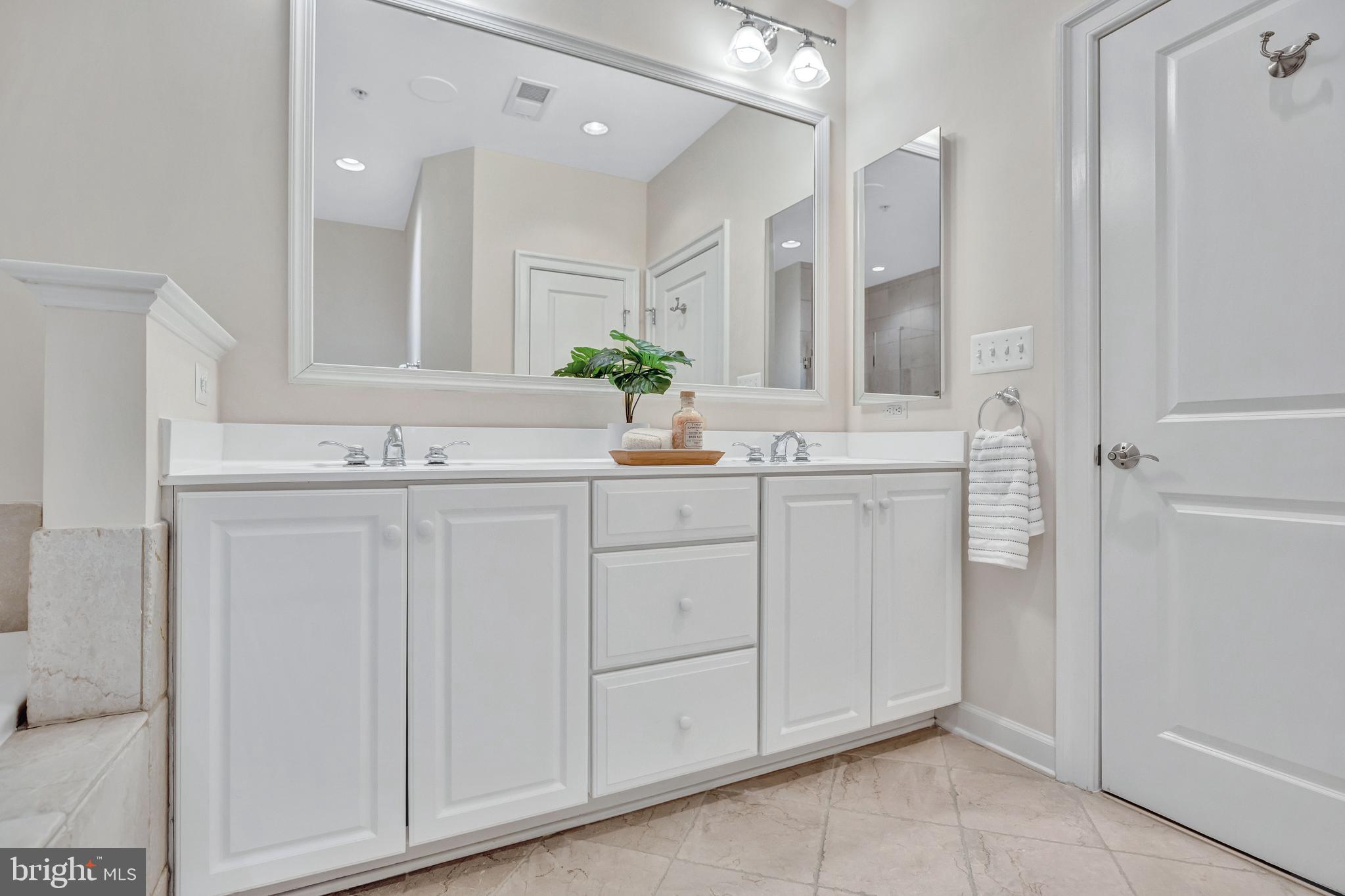 1820 Carpenter Road Alexandria, VA 22314 - Photo 36 of 80 a bathroom with a sink and a mirror