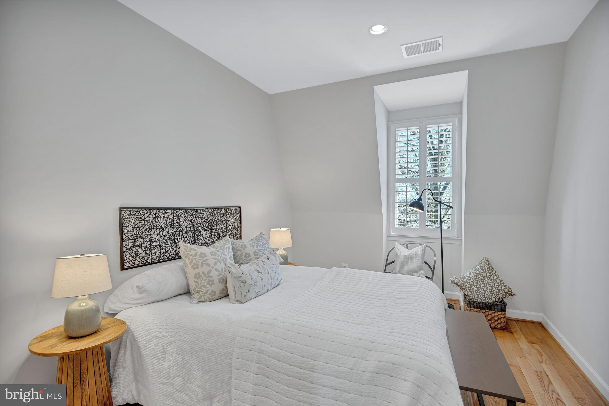 1820 Carpenter Road Alexandria, VA 22314 - Photo 38 of 80 a bedroom with a bed and a night stand