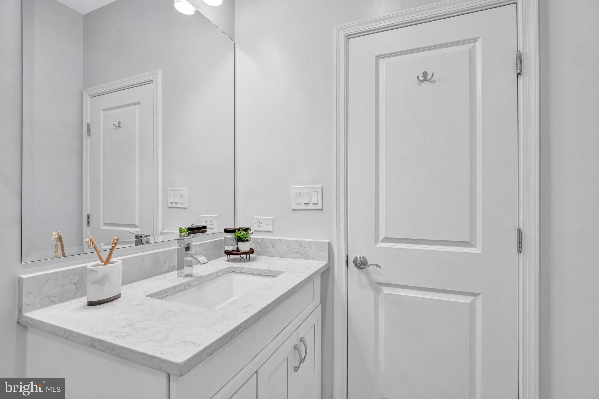 1820 Carpenter Road Alexandria, VA 22314 - Photo 41 of 80 a bathroom with a sink and a mirror