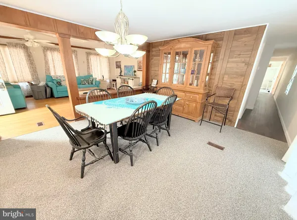 a dining room with furniture and window