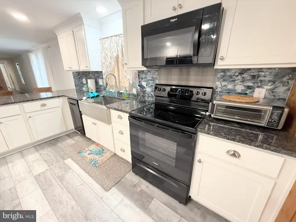 a kitchen with a stove and a microwave