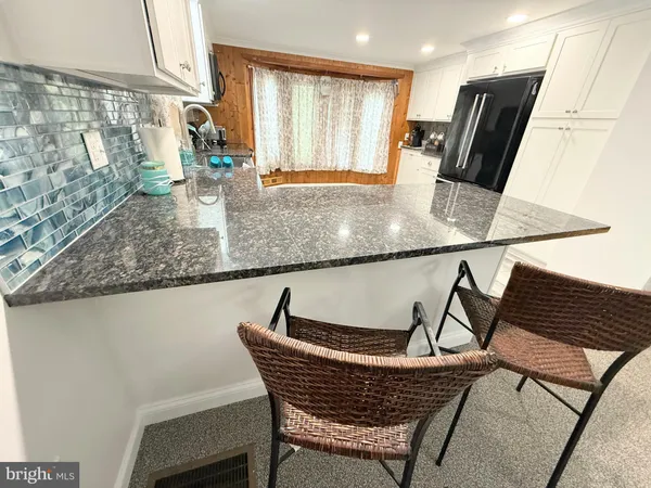 a bedroom with a bed and flat screen tv