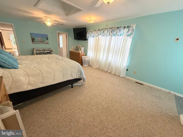 a bathroom with a sink mirror vanity and toilet