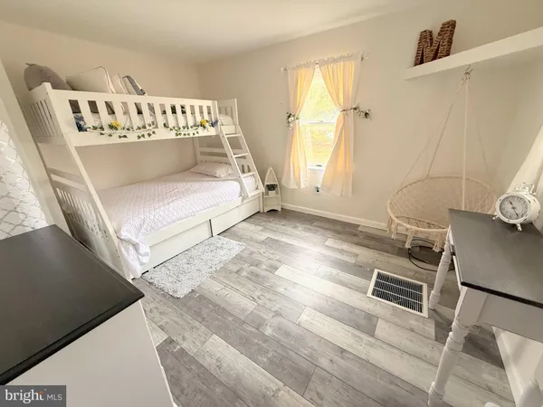 a view of empty room with window and tub