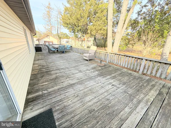 a view of a patio with wooden floor