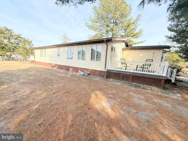 a view of a house with a yard and garage