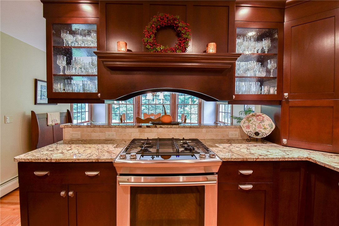 405 Lapham Farm Road Burrillville, RI 02859 - Photo 16 of 50 Gas stove and detailed cabinetry
