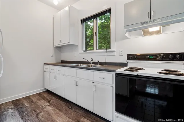 a kitchen with a stove and a sink
