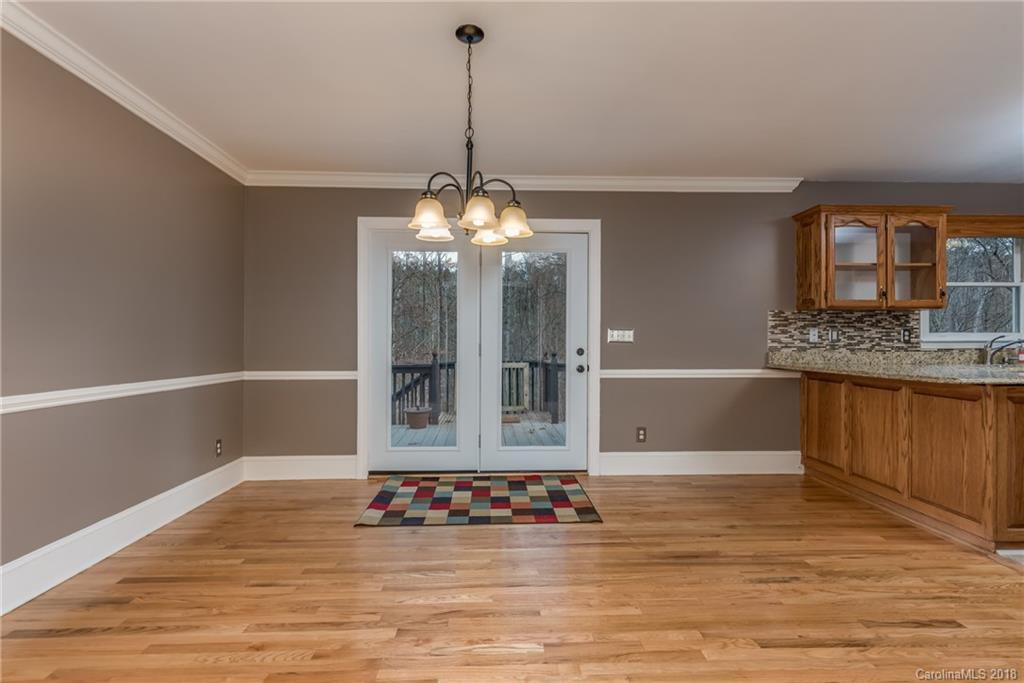 278 Bent Tree Drive Rutherfordton, NC 28139 - Photo 8 of 29 a view of kitchen with kitchen island granite countertop a stove and a wooden floors