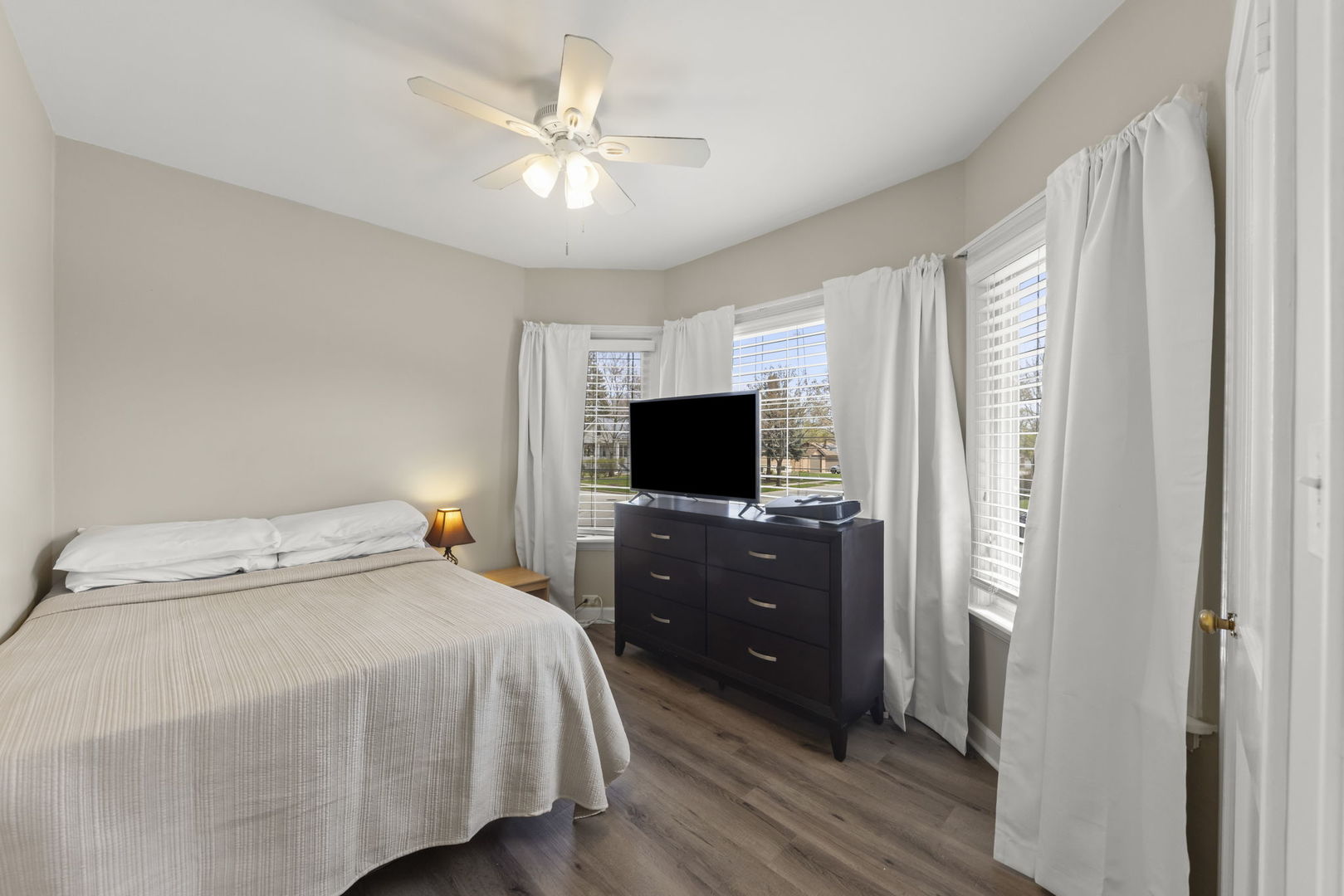 202 Pick Avenue Elmhurst, IL 60126 - Photo 12 of 26 a bedroom with a bed and a flat screen tv