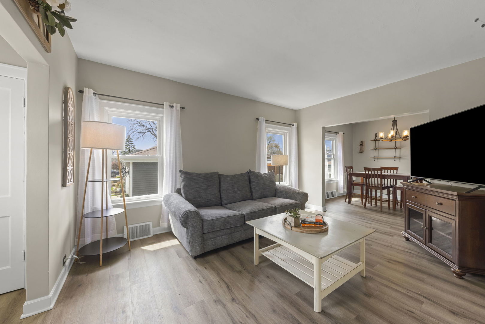 202 Pick Avenue Elmhurst, IL 60126 - Photo 3 of 26 a living room with furniture and a flat screen tv