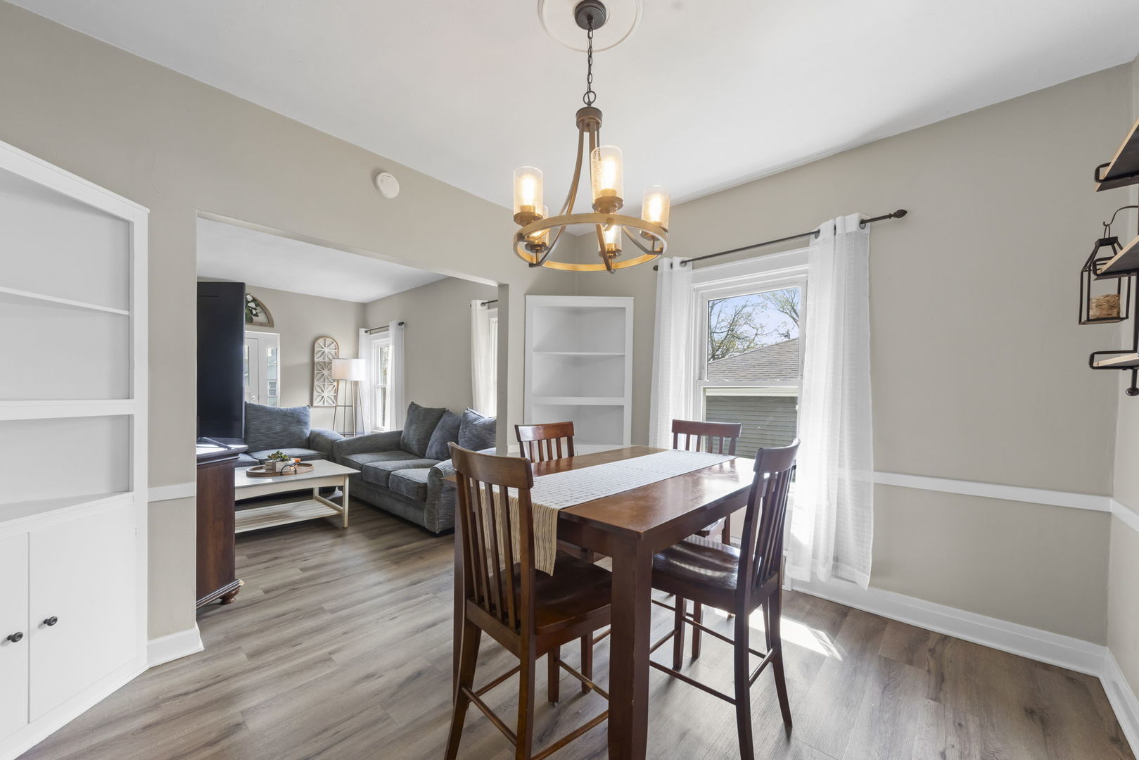 202 Pick Avenue Elmhurst, IL 60126 - Photo 8 of 26 a view of a dining room with furniture wooden floor and chandelier