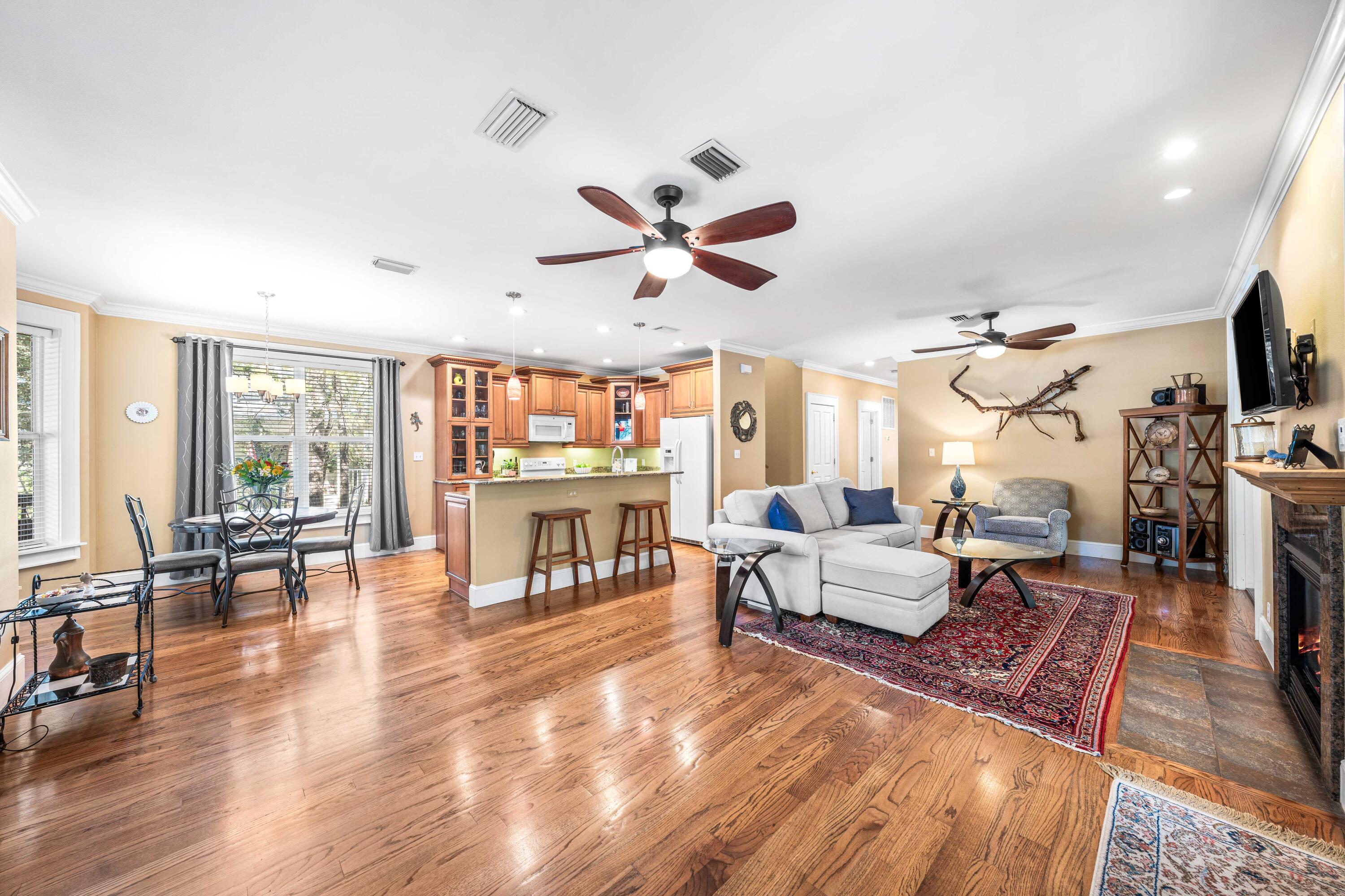 556 Little Canal Drive Santa Rosa Beach, FL 32459 - Photo 20 of 60 a living room with furniture a fireplace and a flat screen tv