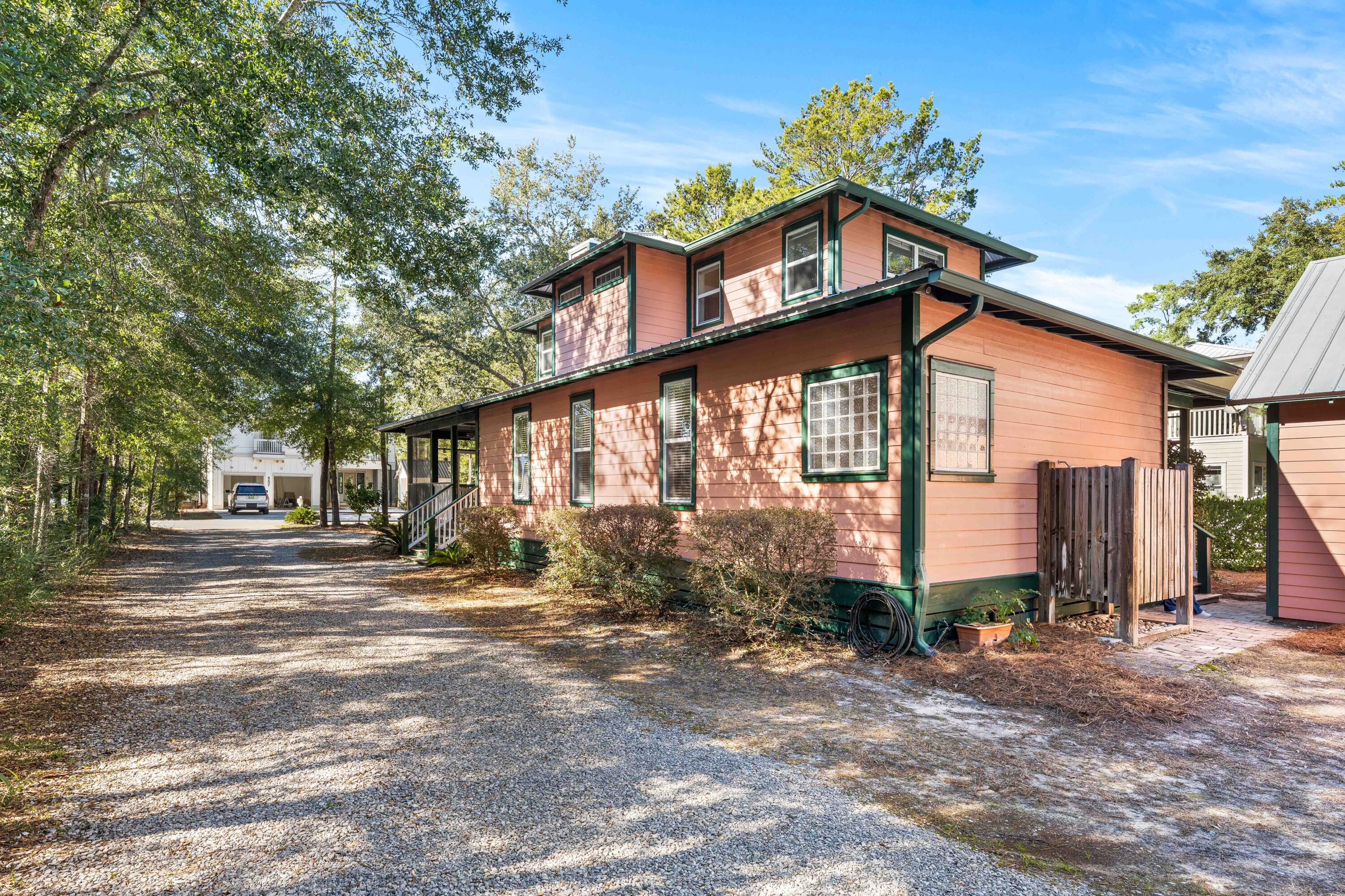 556 Little Canal Drive Santa Rosa Beach, FL 32459 - Photo 2 of 60 a front view of a house with a porch