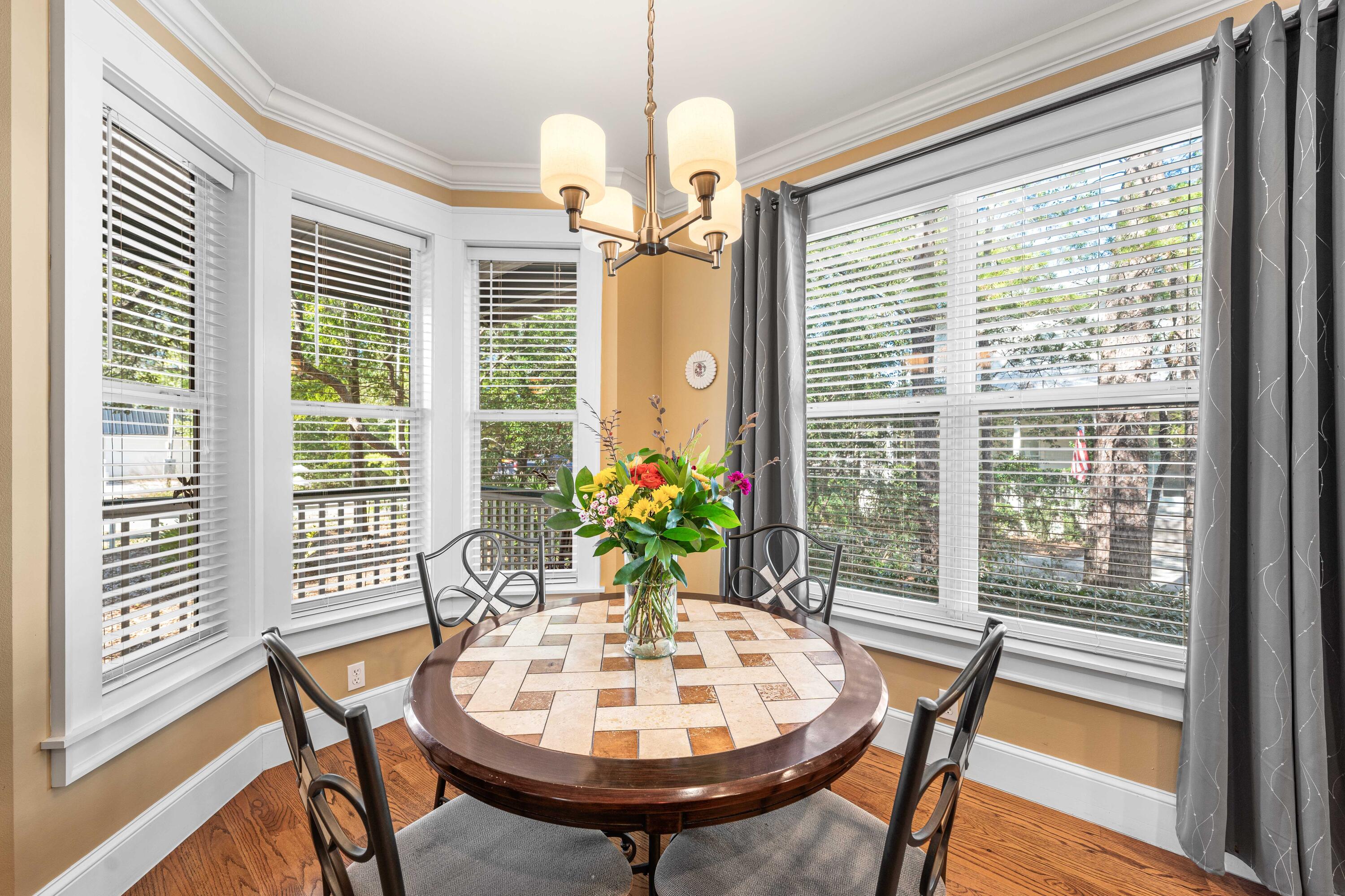 556 Little Canal Drive Santa Rosa Beach, FL 32459 - Photo 22 of 60 a view of a dining room with furniture window and wooden floor