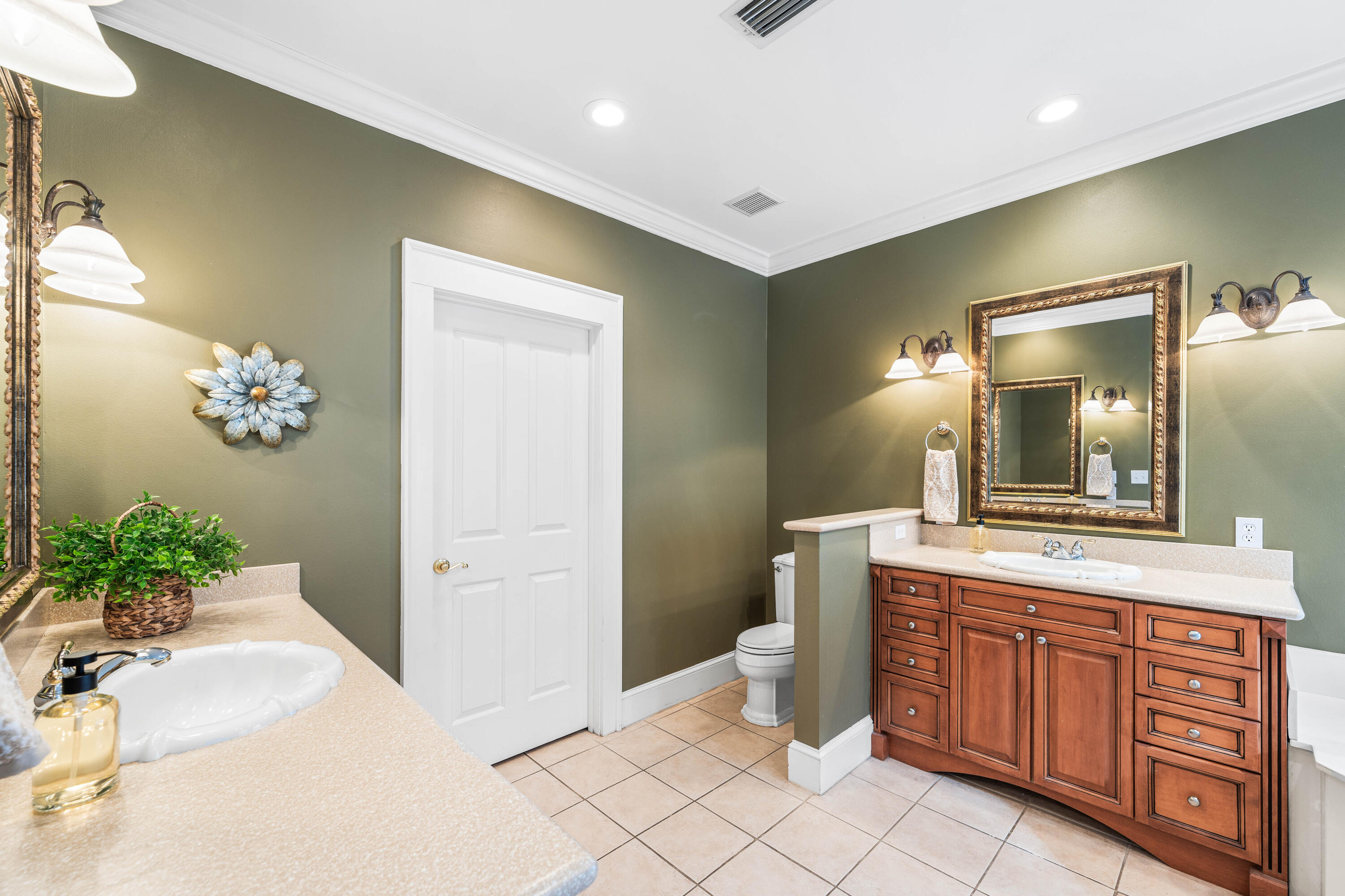 556 Little Canal Drive Santa Rosa Beach, FL 32459 - Photo 36 of 60 a spacious bathroom with a granite countertop sink and a mirror