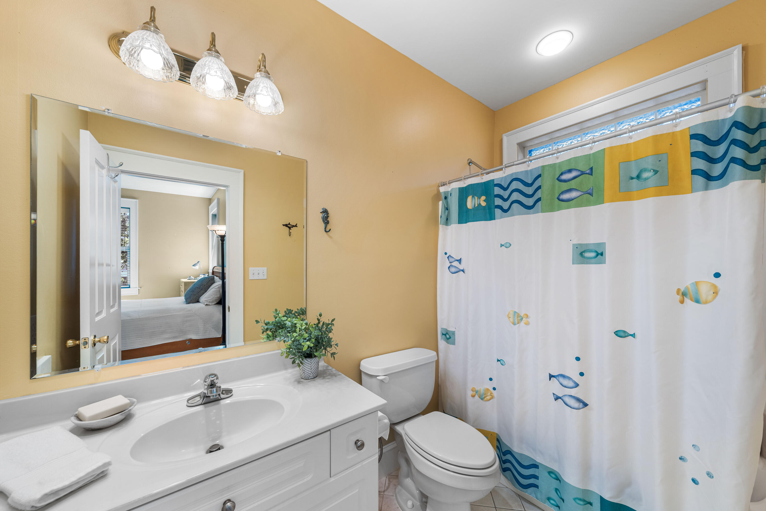 556 Little Canal Drive Santa Rosa Beach, FL 32459 - Photo 47 of 60 a bathroom with a sink a toilet and shower