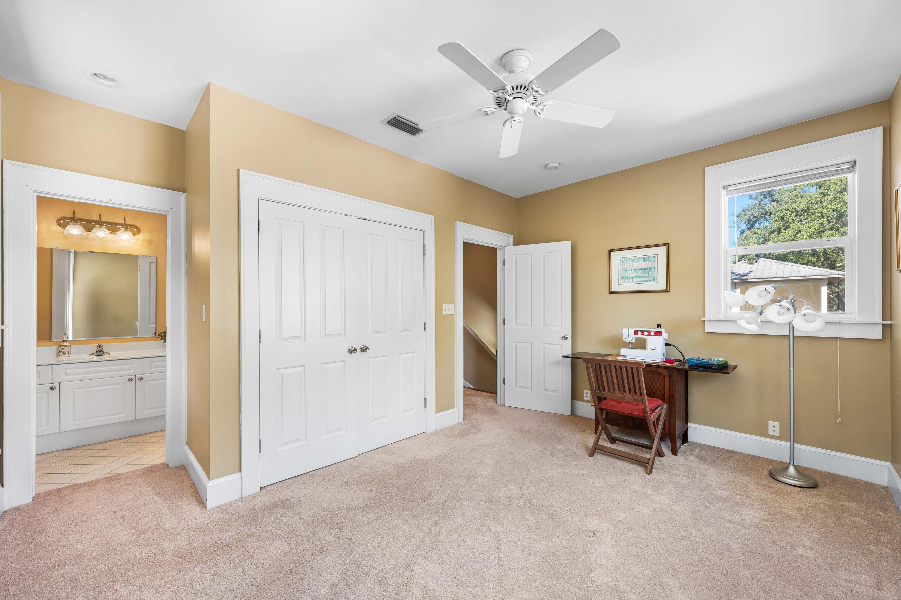 556 Little Canal Drive Santa Rosa Beach, FL 32459 - Photo 49 of 60 a view of a workspace with furniture and a window