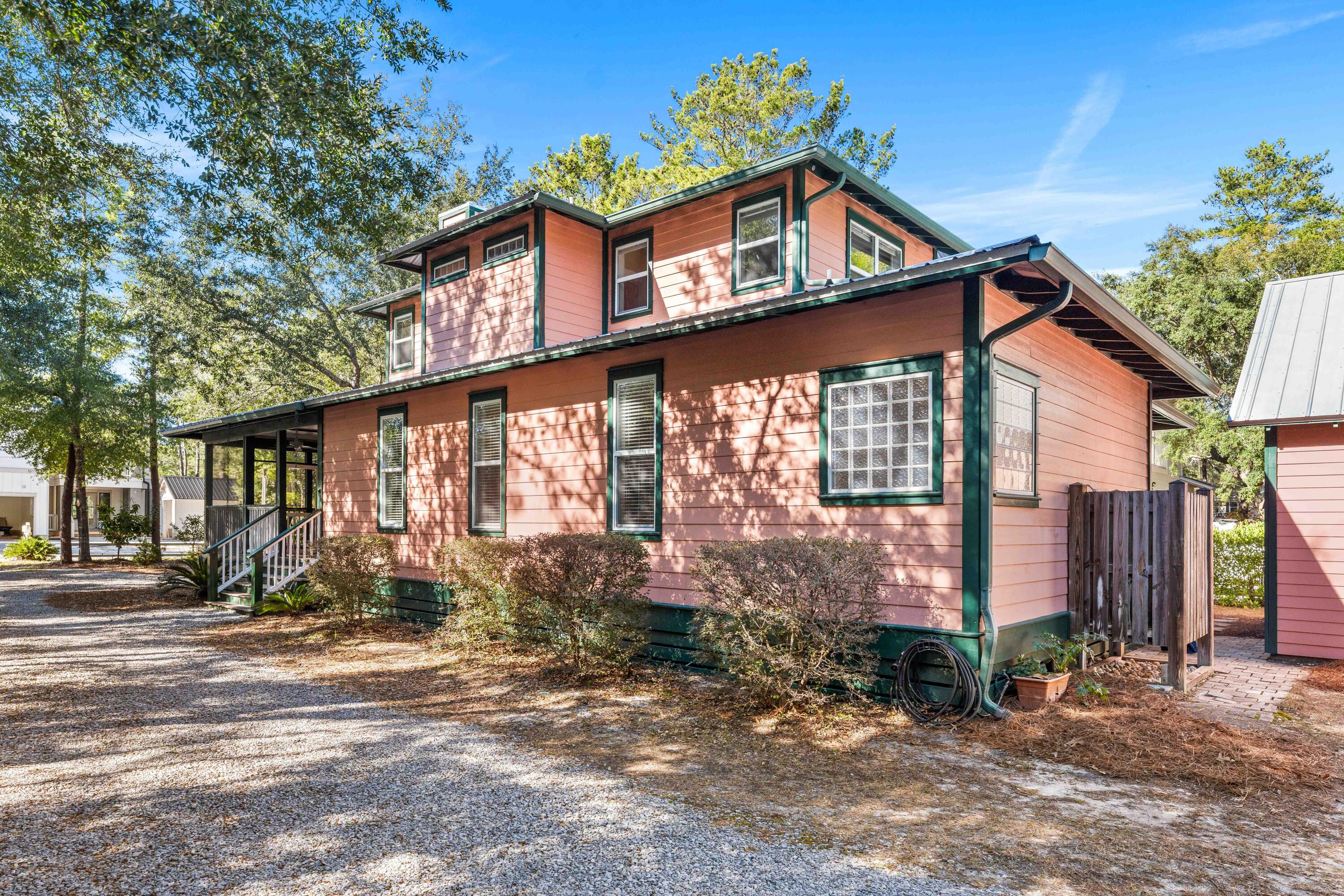 556 Little Canal Drive Santa Rosa Beach, FL 32459 - Photo 5 of 60 a front view of a house with a yard