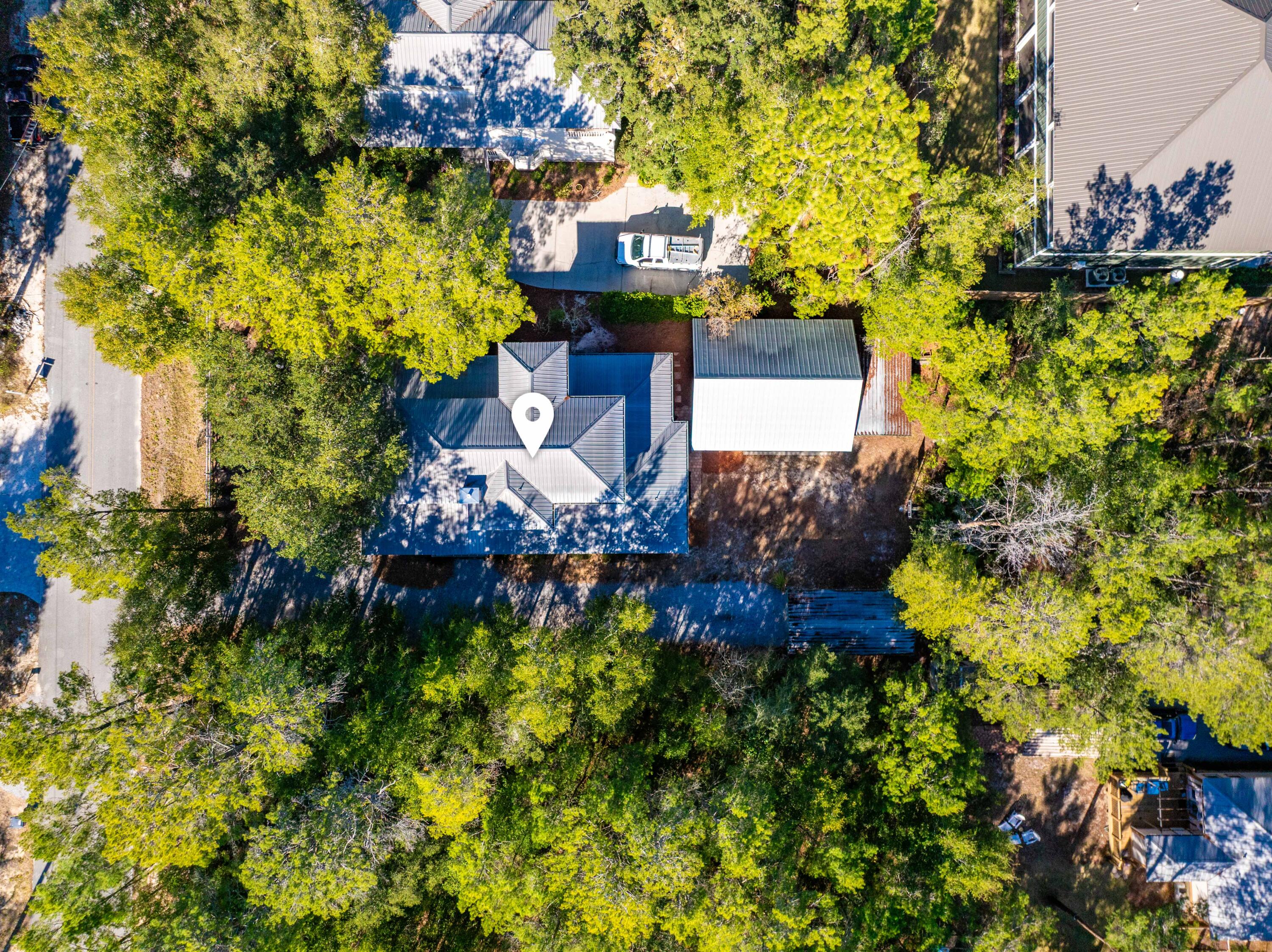 556 Little Canal Drive Santa Rosa Beach, FL 32459 - Photo 59 of 60 a view of a house with a yard and garden